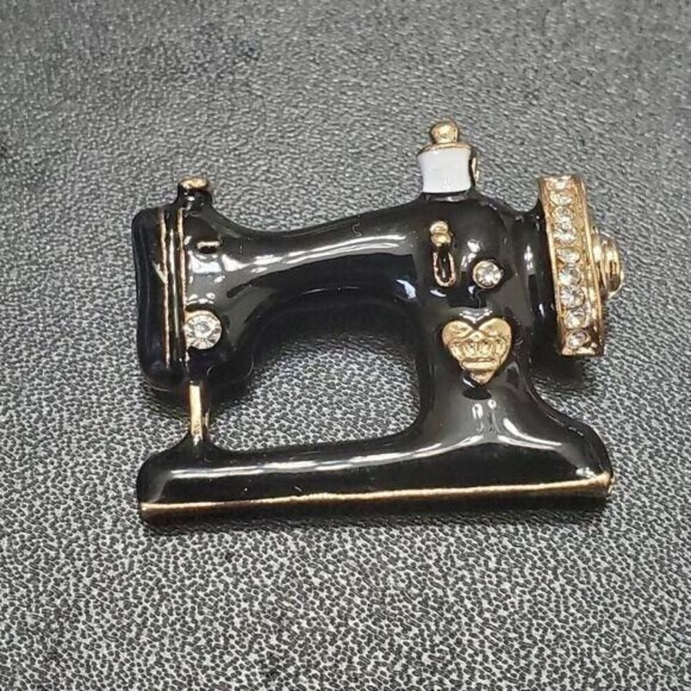 Black enamel sewing machine brooch gold tone